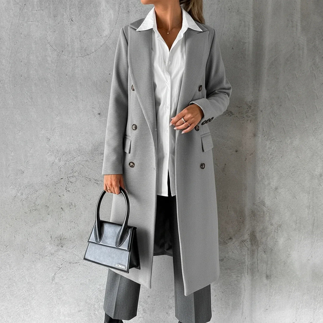 Sophisticated women's long winter coat, double-breasted. Elegant design provides warm, chic fall/winter fashion.