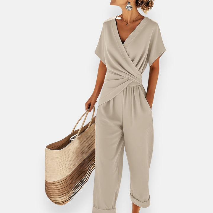 Chic women's draped bow jumpsuit, combining comfort & style for formal events, summer fashion, or casual elegance.