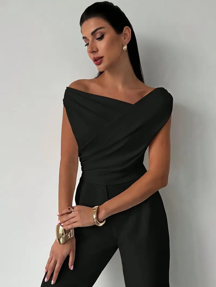 Chic women's top, fashion-forward with a sophisticated draped shoulder design. Versatile wear.