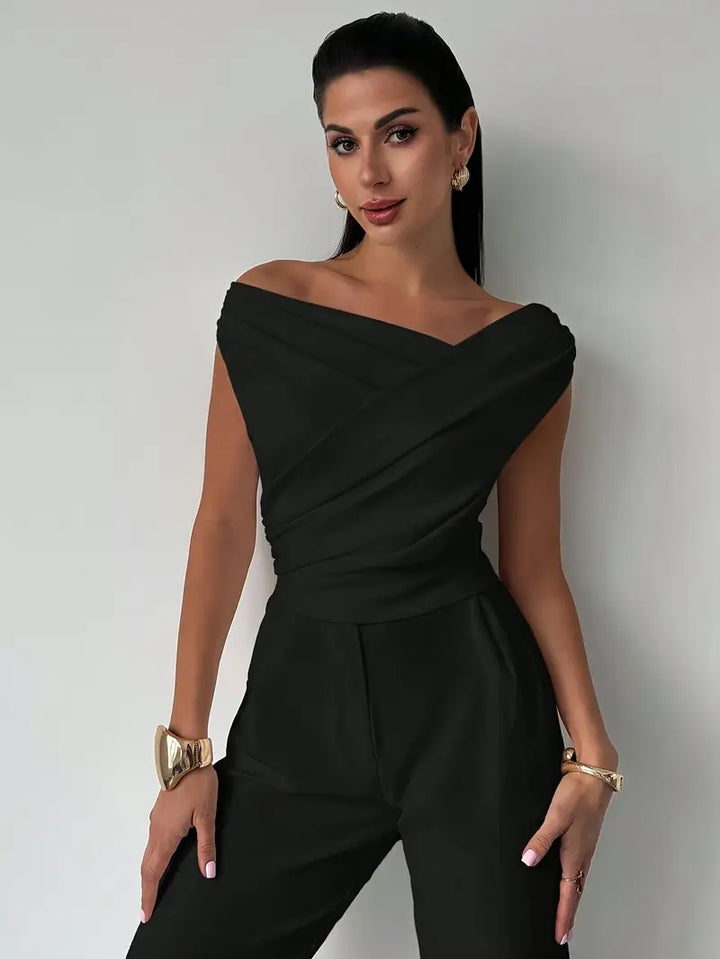 Stylish women's draped shoulder blouse, versatile for office wear or a chic evening look.