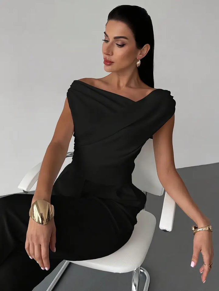 Elegant women's top with a unique draped shoulder. A fashion-forward piece for any wardrobe.