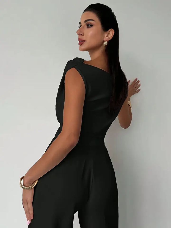 Women's sophisticated draped shoulder top, offering both comfort and high-end style.