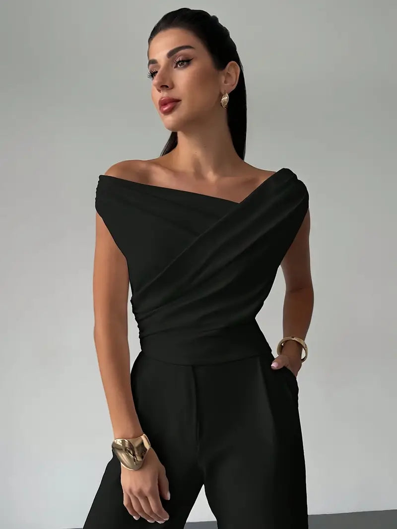 Chic women's top with a graceful draped shoulder, ideal for a stylish, fashion-forward look.