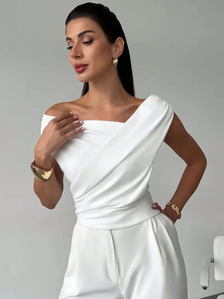 Stylish women's draped shoulder blouse, offering a refined and elegant look for any event.