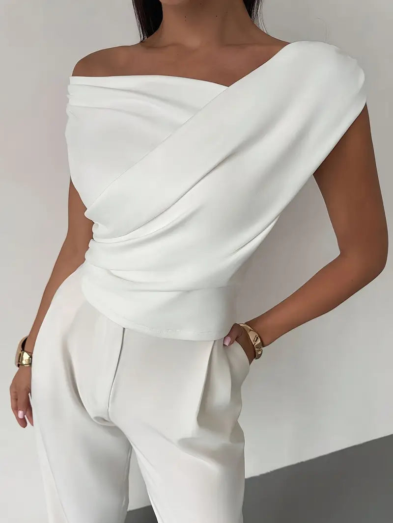 Women's sophisticated top with a graceful draped shoulder, embodying modern elegance.
