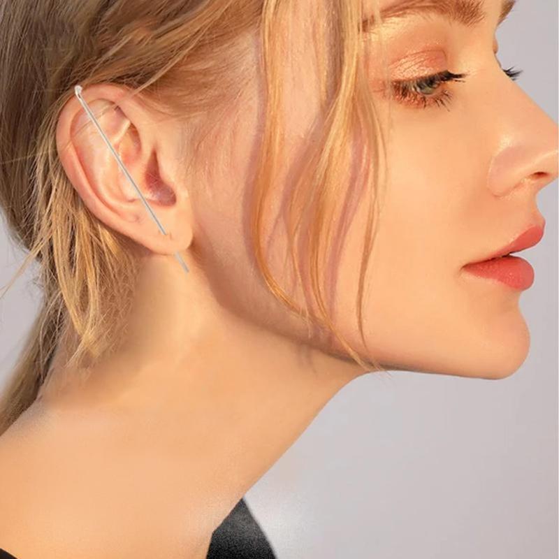 Model wearing an elegant women's ear wrap crawler earring, stylish accessory for any occasion. Ear detail.
