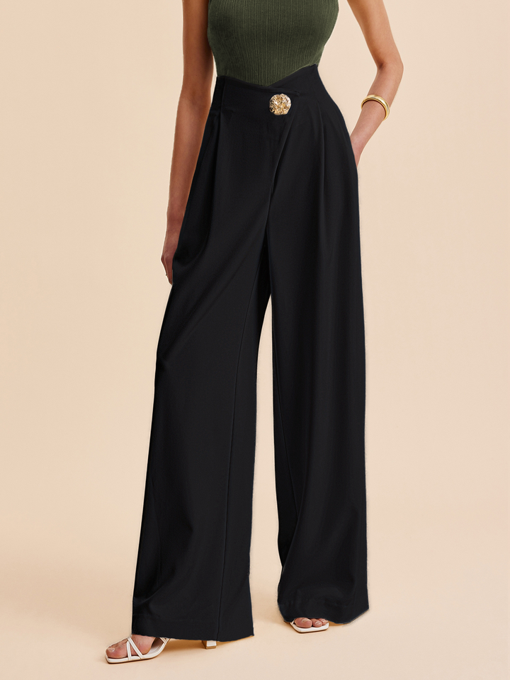 Modern fashionable women's asymmetrical embellished high-waist wide-leg pants. Sophisticated and stylish for any occasion.