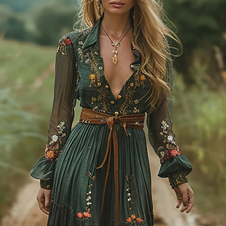 Flowing women's bohemian style maxi dress with graceful long sleeves and beautiful embroidered details.