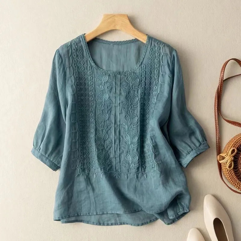 Loose fit women's casual chic blouse featuring delicate embroidery, puff sleeves & versatile three-quarter sleeves.