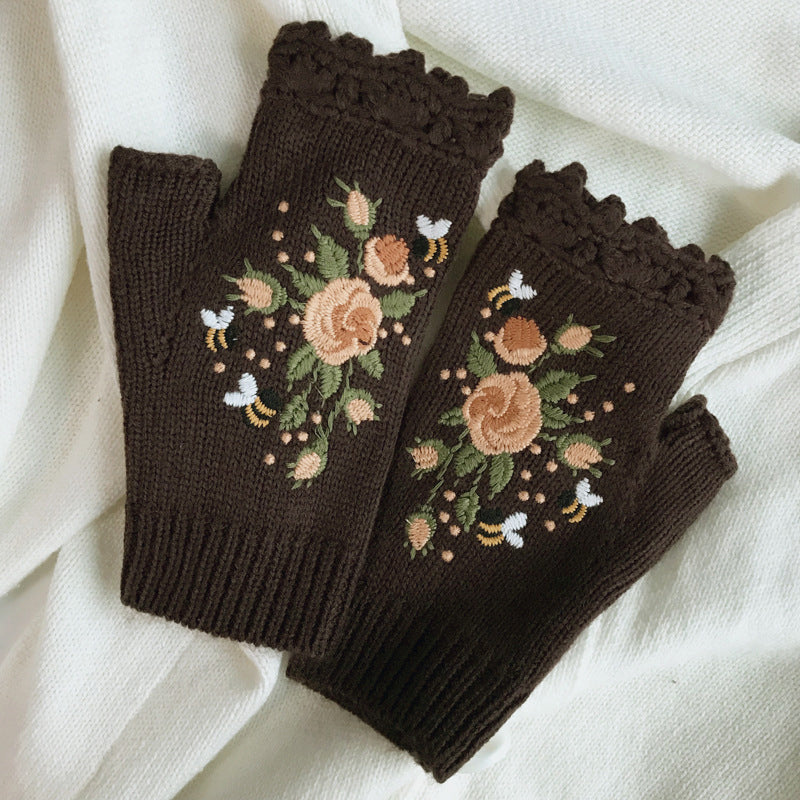Women's warm winter gloves with embroidered details, providing both style and essential cold weather protection.