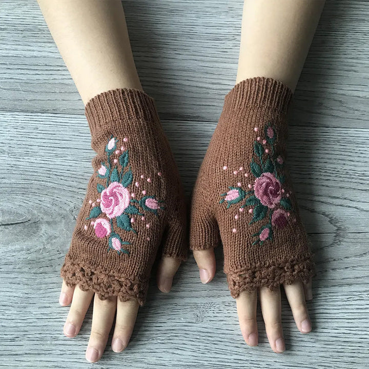 Pair of warm women's embroidered winter gloves, ideal for cold weather, stylish acrylic fashion accessory.