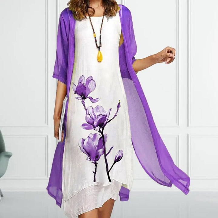 Chic women's matching floral print midi dress set with a flowing sheer overlay, ideal for elegant occasions.