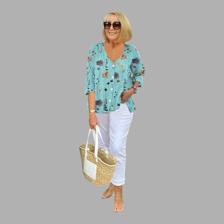 Elegant women's floral blouse, long sleeve button-up top for a refined, semi-formal style.