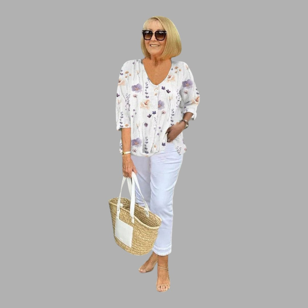 Chic women's apparel: a detailed view of an elegant floral long sleeve blouse, button-up design.