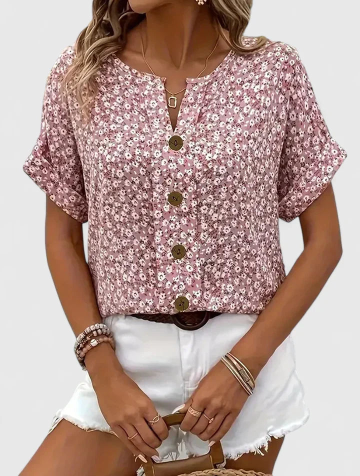 Elegant women's floral blouse with long sleeves, perfect for stylish spring and summer wear. Comfortable button-up top.
