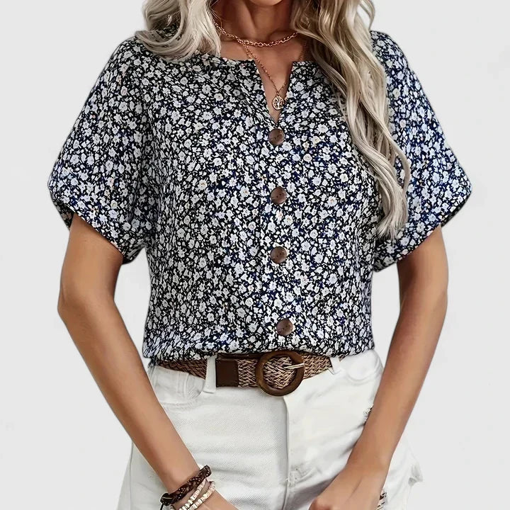 Stylish women's long sleeve blouse featuring a vibrant floral print, an elegant and comfortable button-up top for ladies.