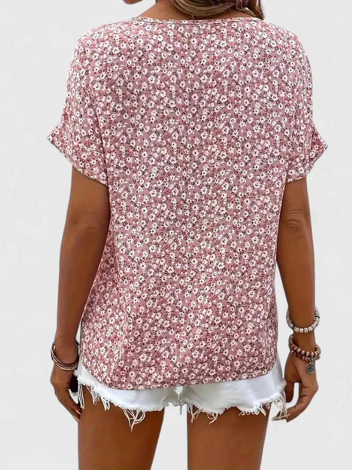 Comfortable women's button-up floral blouse with elegant long sleeves, a stylish top for spring and summer casual wear.
