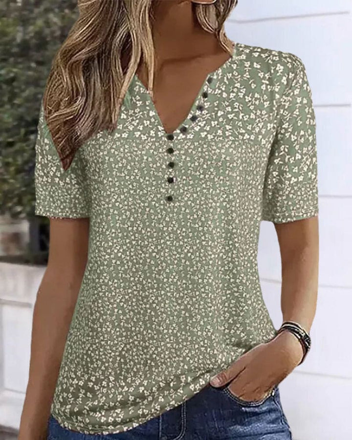 Elegant women's floral button-up shirt for summer, perfect for casual wear or a chic vacation outfit.