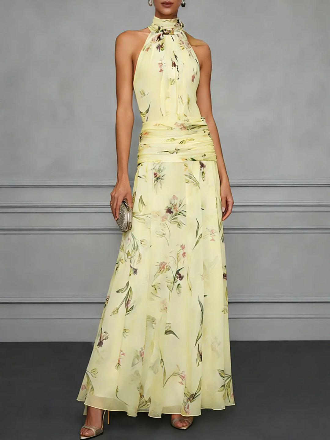 Flowy floral halter maxi dress with adjustable waist for women. Elegant sleeveless design, ideal for events.