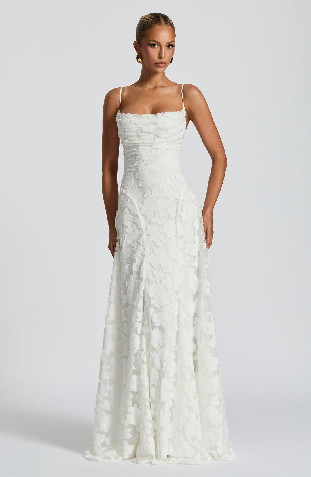 Sophisticated women's jacquard gown, a strappy floral maxi dress for evening events.