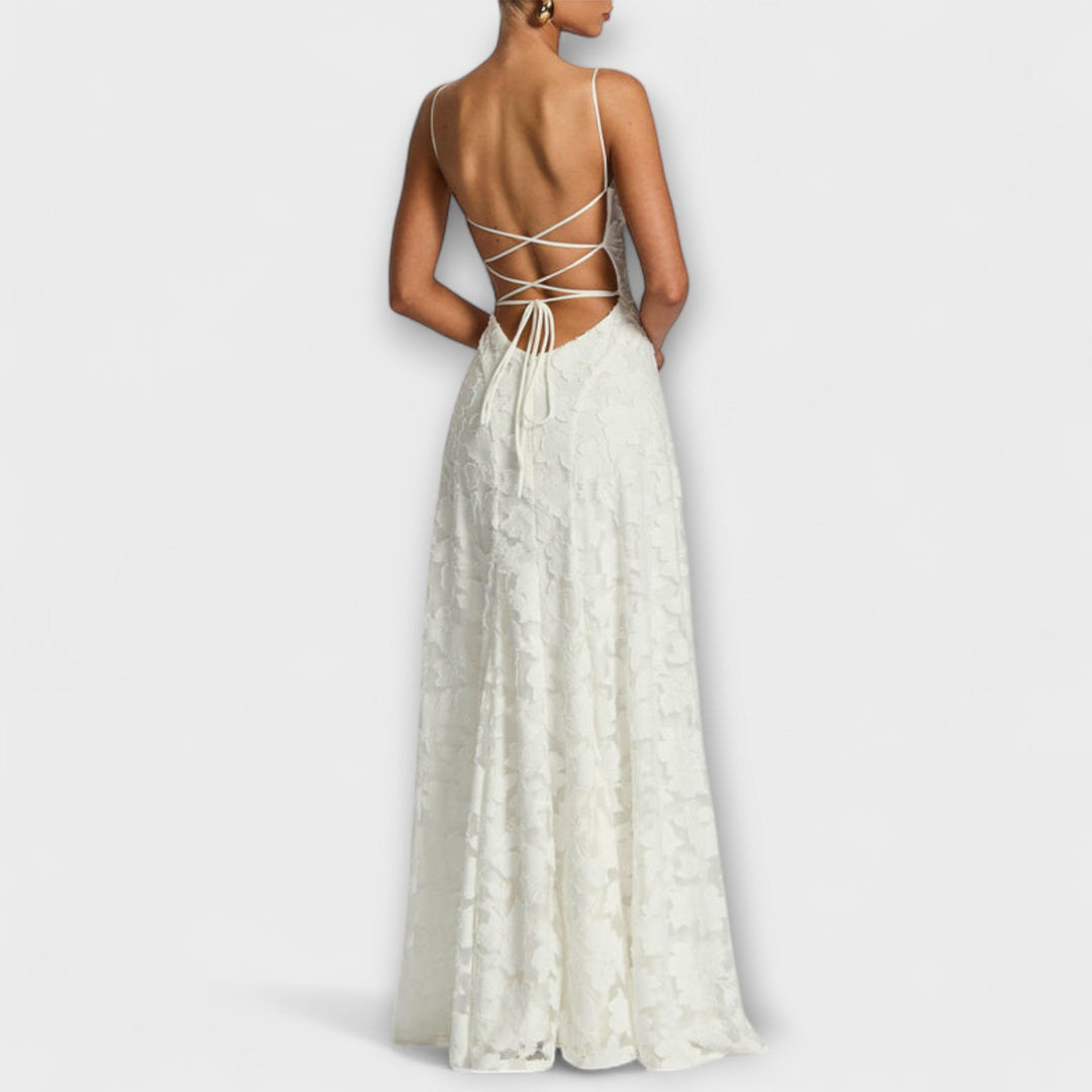 Close-up of intricate floral lace on an elegant women's maxi dress, ideal for parties & special events.