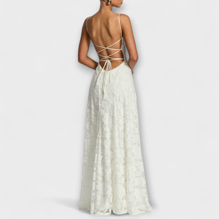Close-up of intricate floral lace on an elegant women's maxi dress, ideal for parties & special events.