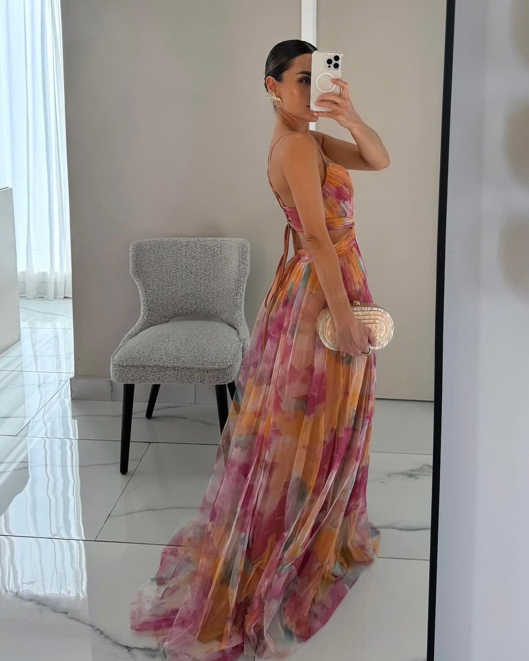 Graceful sleeveless floral maxi dress for women. Its flowy fabric makes it a perfect elegant summer party dress.