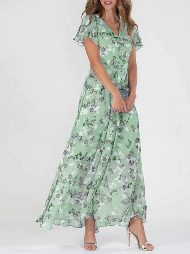 Flowing women's floral flutter sleeve maxi dress. Features a stylish V-neck, ideal for elegant occasion wear.