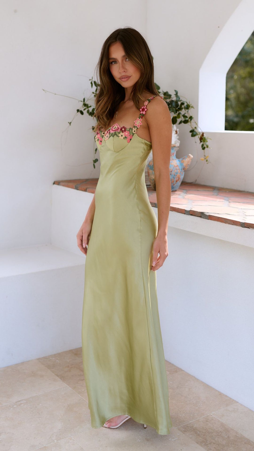 Slim strap maxi dress for women, adorned with a vibrant floral pattern, suitable for casual outings.