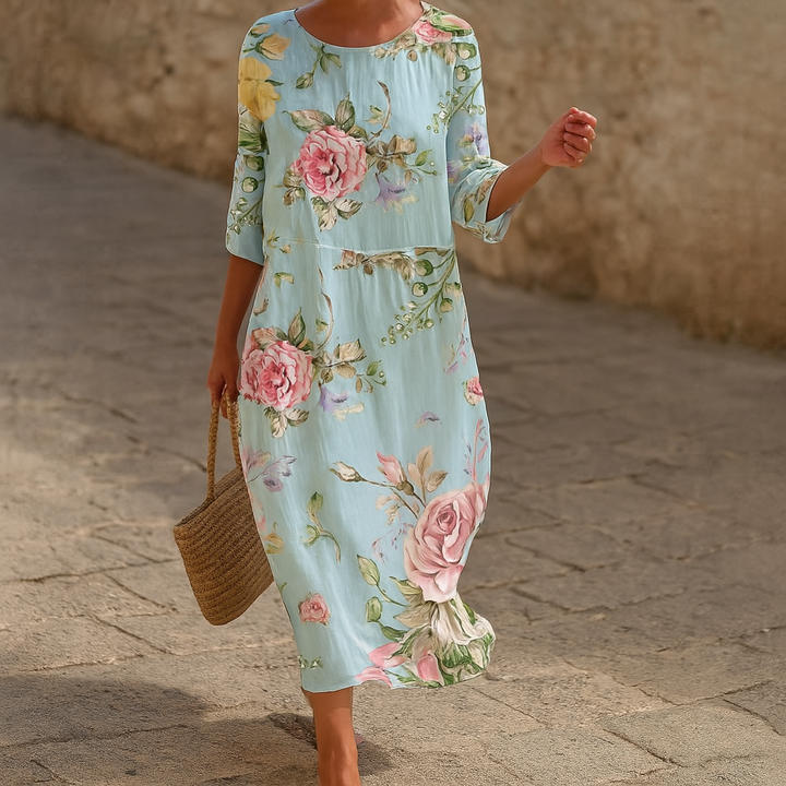 Elegant women's floral midi dress for summer parties. Features flowy fabric and modest sleeves, perfect for special occasions.