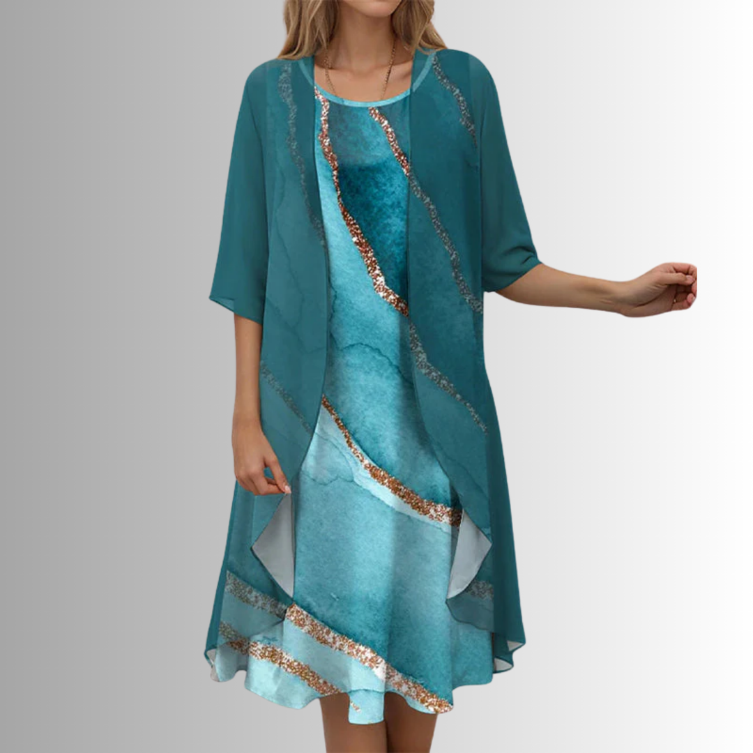 Women's elegant floral midi dress with a flowy sheer cardigan, suitable for garden party style.