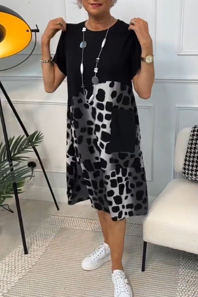 Elegant women's floral midi dress with a defined waist, perfect for spring and summer events.