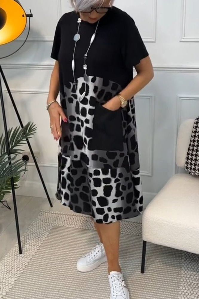 Flowy floral midi dress for women, elegant and sophisticated with a flattering defined waistline.