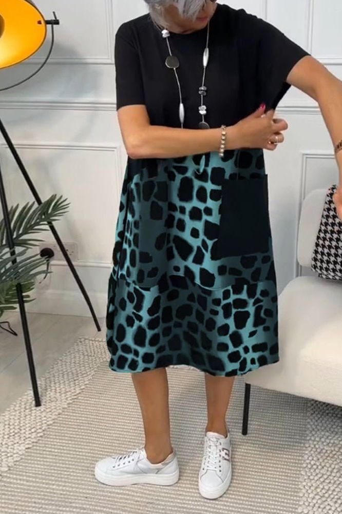 Vibrant floral midi dress for women, designed with an elegant cut and a flattering defined waist.