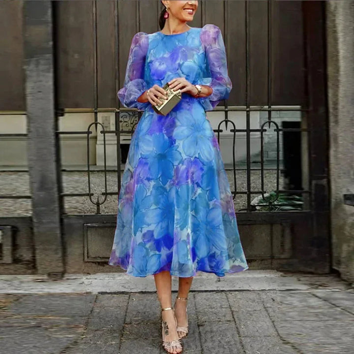 Romantic women's floral midi dress with long sleeves, ideal for a summer wedding, brunch, or elegant party.