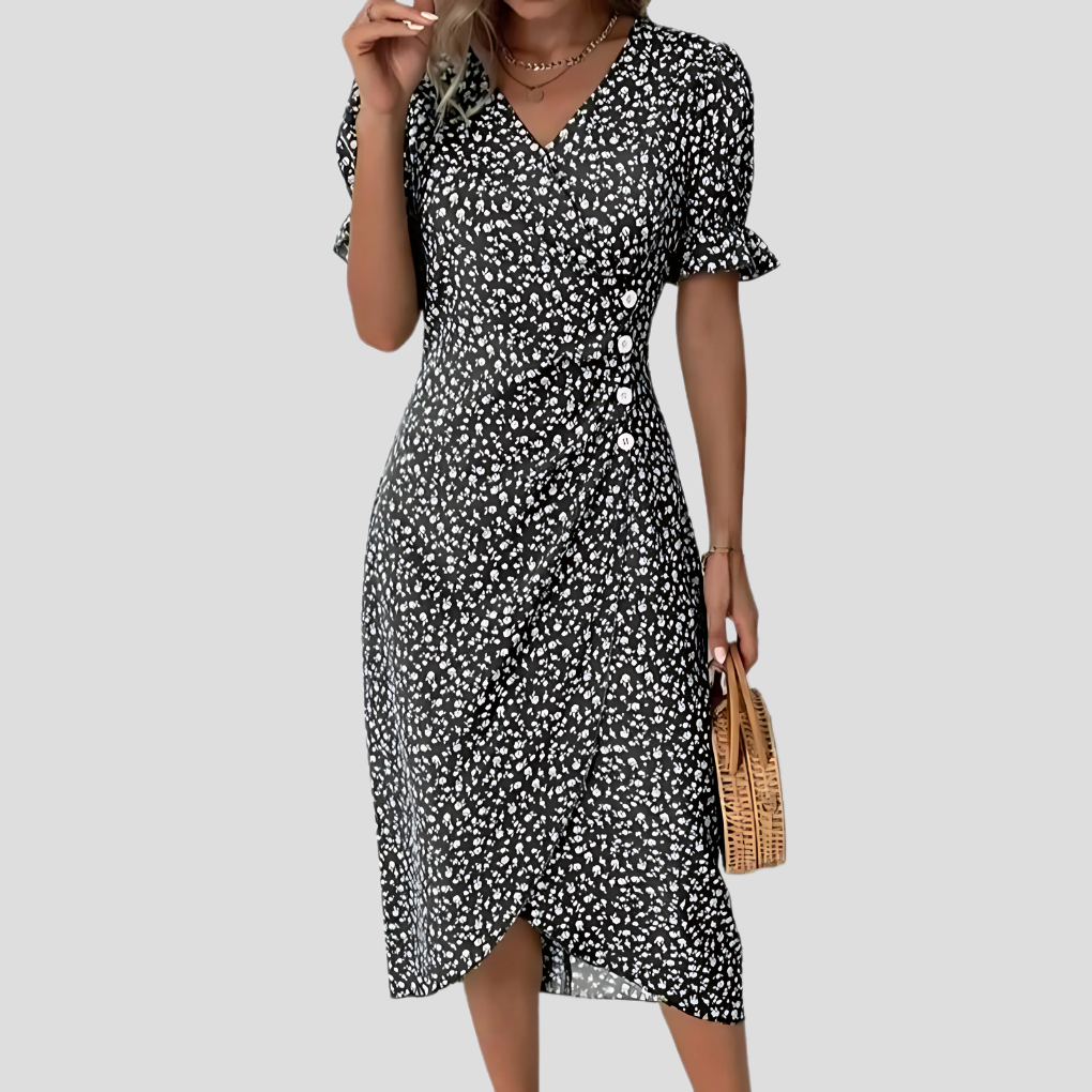 Feminine A-line floral midi dress featuring stylish puff sleeves and a flattering ruched waist design.