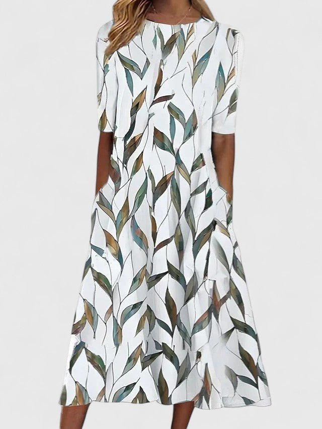 Comfortable women's floral midi dress in coastal boho style, ideal for summer days & easy care travel.