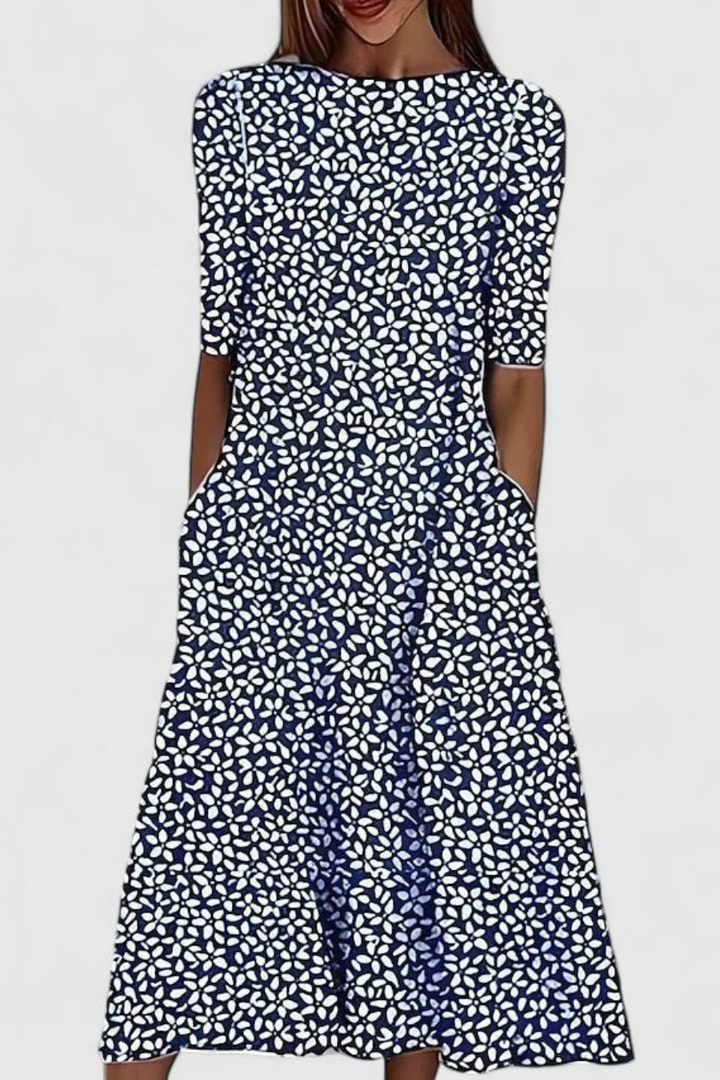 Chic women's floral midi dress. Features a comfy round neck, short sleeves & practical pockets. Ideal for spring & summer.