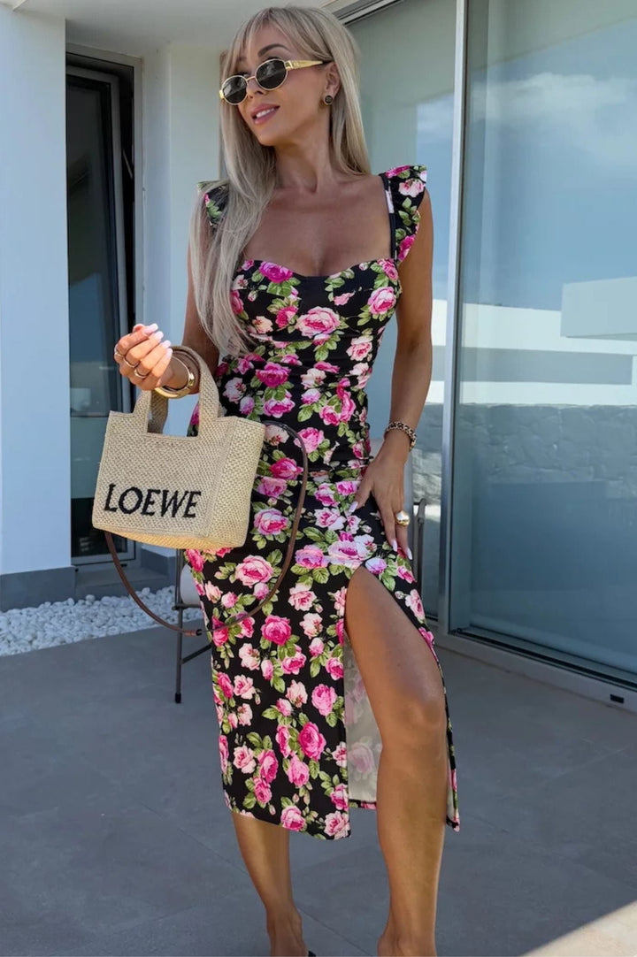 Stylish women's summer midi dress, vibrant floral print, elegant side slit, and charming ruffle straps.