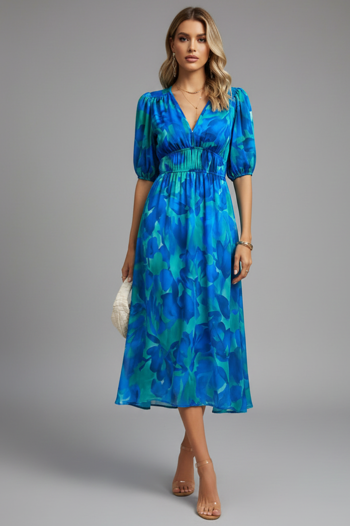 Women's v-neck midi dress featuring a vibrant floral print and elegant puff sleeves. Ideal for day wear.