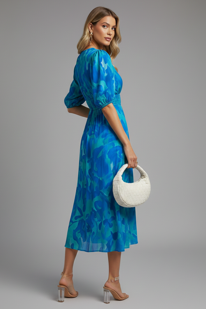 Spring/summer women's floral midi dress with charming puff sleeves and a flattering v-neck design.