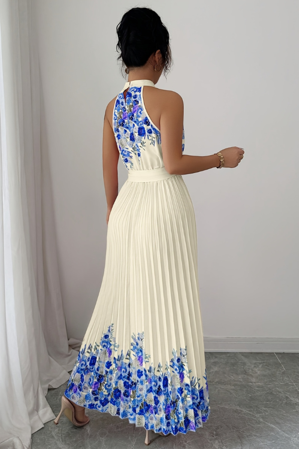 Brightly lit elegant women's floral pleated midi dress, showcasing its vivid colors & square neck.