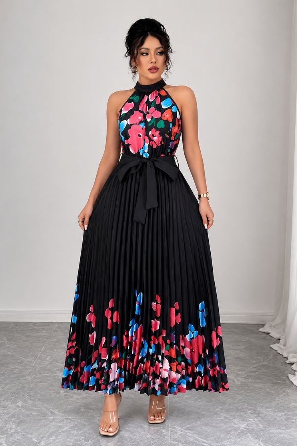 Texture detail of the soft fabric and crisp pleats on the women's floral square neck midi dress.