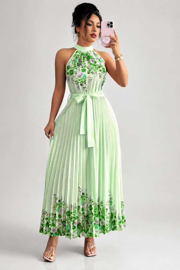 Back view of the women's floral midi dress, highlighting the pleated design & flowy skirt.