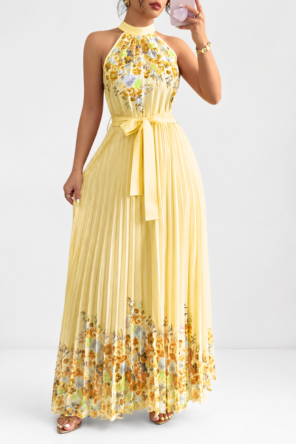 Detailed shot of the beautiful floral pattern and fine pleats on the women's midi dress.