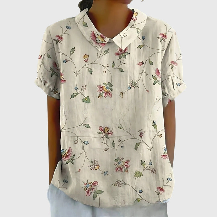 Stylish women's floral blouse with loose fit, comfortable for summer and spring wear.