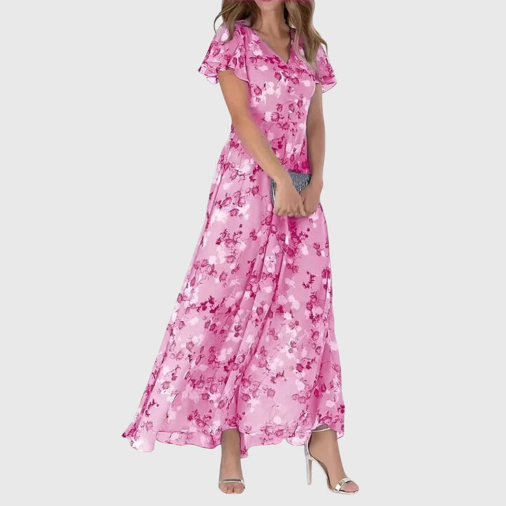Women's summer floral maxi dress with flutter sleeves & A-line cut. Perfect comfortable party or casual evening attire.