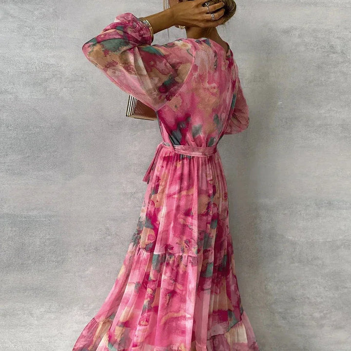 Women's beautiful floral print wrap maxi dress, designed with a V-neck and long sleeves for a sophisticated look.