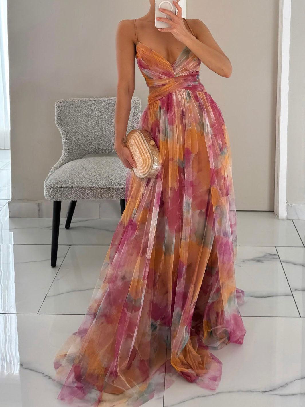 Elegant women's floral sleeveless maxi dress with V-neck, A-line silhouette, and tie waist for summer parties.