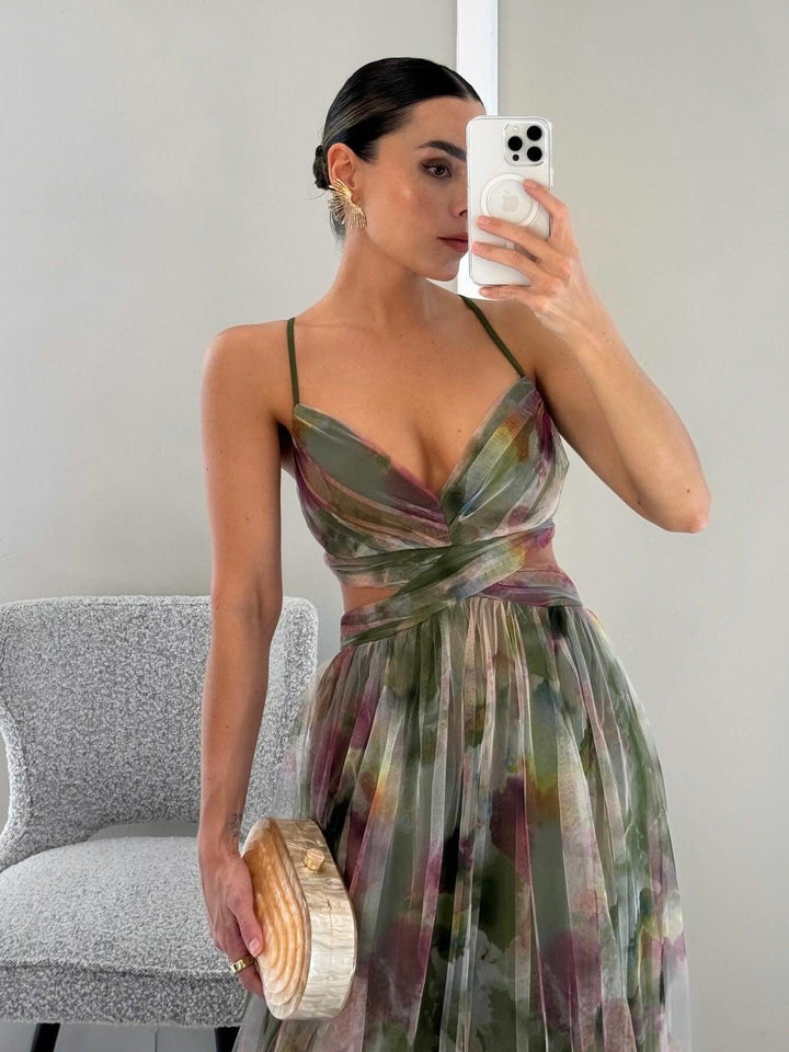 Vibrant floral sleeveless V-neck maxi dress for women, an elegant A-line tie-waist perfect for parties.